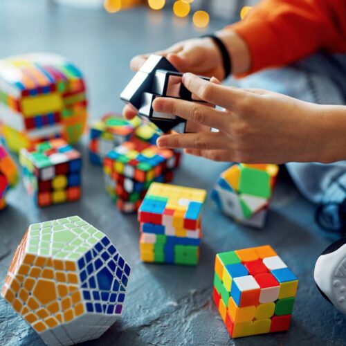 image of a kid working with problem solving toys